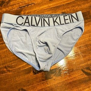 NWOT. Calvin Klein men’s briefs, size Med. light blue